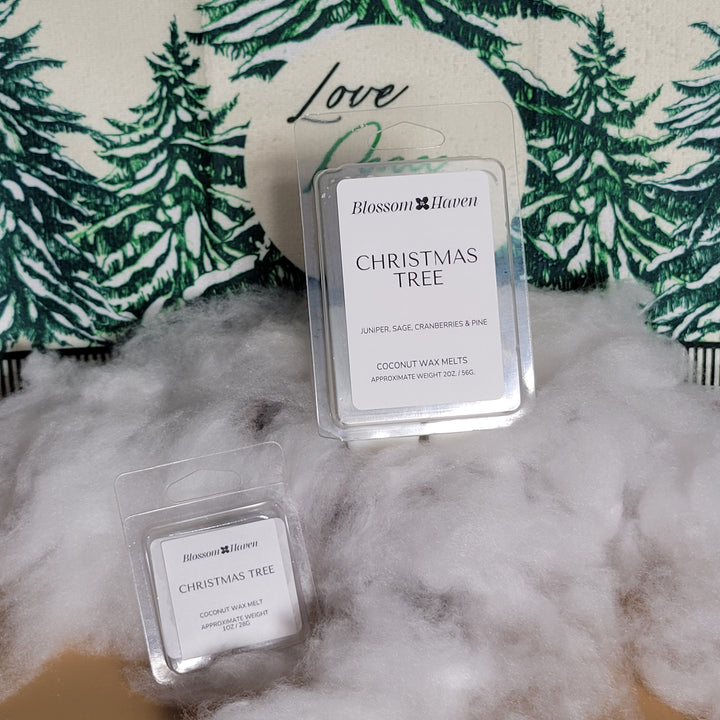 Two small rectangular products labeled 'Christmas Tree' on a textured surface with green leaf pattern.
