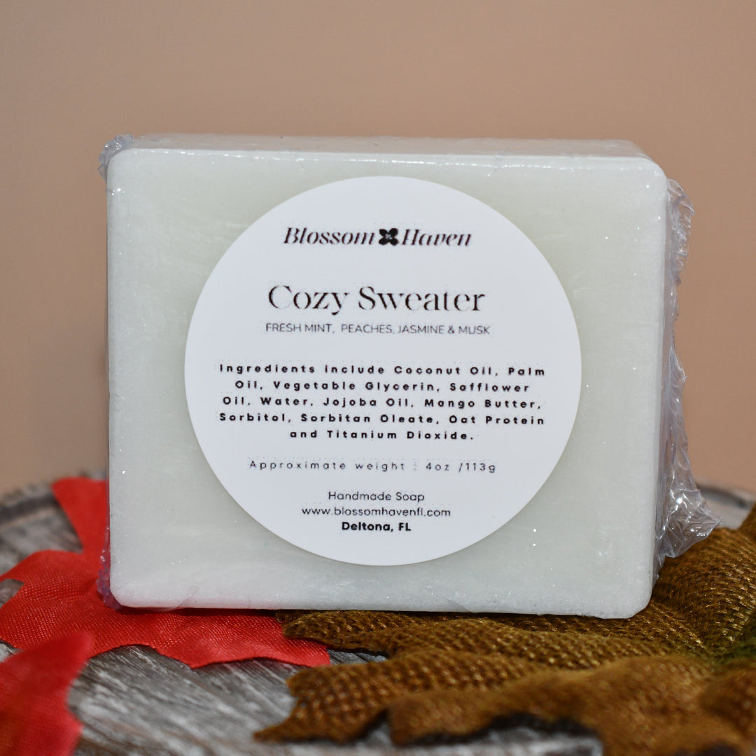 Bar of soap with a label on a wooden surface